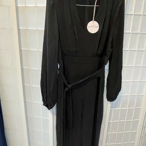Brand new black jumpsuit. Long sleeve. Fit is like a U.S. size 10.